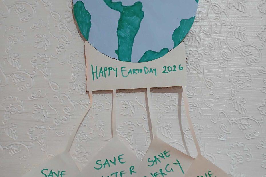 An image of a hand-made global with four call-to-actions hanging from it. The call-to-actions are "Save Trees", "Save Water", "Save Energy", and "Save Earth"